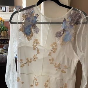 White dress with gold and light blue accents